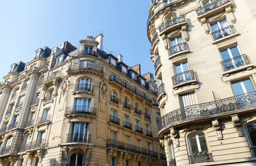 Traditional French houses with typical balconies and windows. Paris.