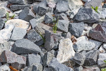 Untreated rough natural stone in everyday environment, gardening and landscaping