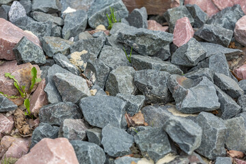 Untreated rough natural stone in everyday environment, gardening and landscaping