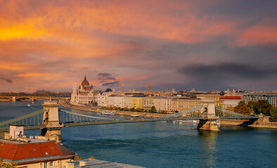 Fototapeta na wymiar Panoramic sunset view with Chain bridge of Budapest parliament building capital of Hungary