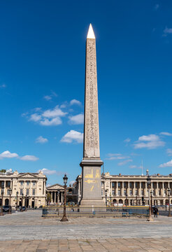 Luxor obelisk on place de la concorde with the madeleine church in the background - Paris, France