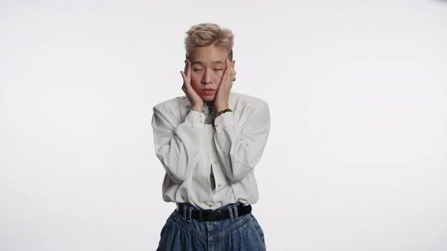 Fashionable Asian person tries to deal with stress