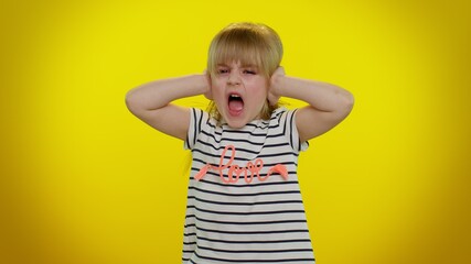 Dont want to hear and listen. Frustrated annoyed irritated blonde kid child 5-6 years old covering ears and gesturing no, avoiding advice ignoring unpleasant noise loud voices. Naughty teenager girl