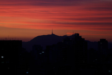 Silhouette of the Jaragua peak and telecommunications antennas are seen in Sao Paulo, Brazil during a beautiful sunset.