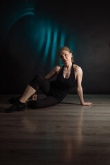 Fototapeta na wymiar portrait of a dancer posing on the floor 
