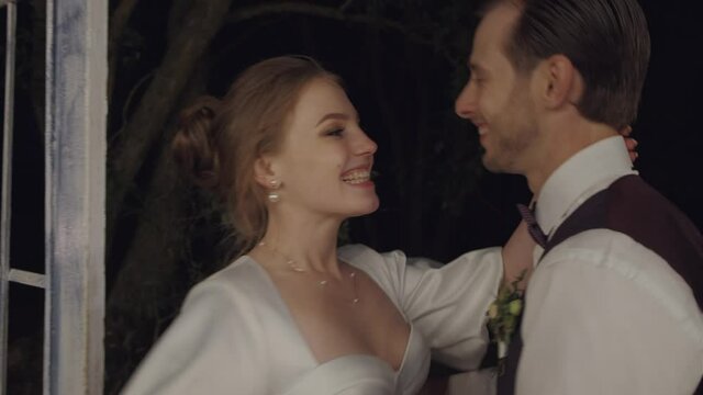 a couple in love runs together. a happy couple. a couple in love on a beautiful evening veranda.