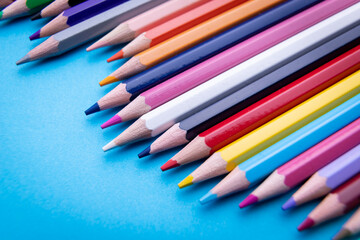 Colorful pencil set on blue background