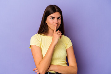 Young caucasian woman isolated on purple background unhappy looking in camera with sarcastic expression.