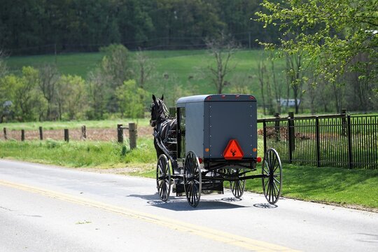 Amish horse carriage on a country road in Lancaster County P.A.