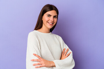 Obraz premium Young caucasian woman isolated on purple background laughing and having fun.