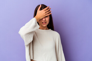Fototapeta premium Young caucasian woman isolated on purple background touching temples and having headache.