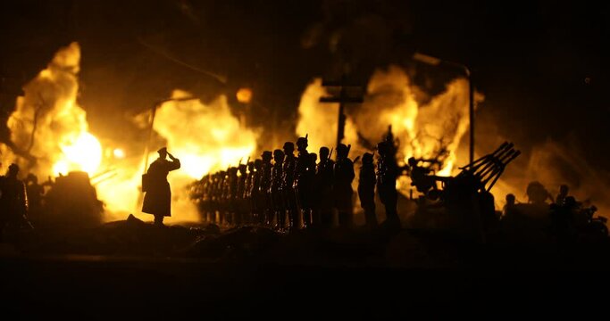 War Concept. Military silhouettes fighting scene on war fog sky background, World War Soldiers Silhouette Below Cloudy Skyline At night. German soldiers in ranks. Selective focus