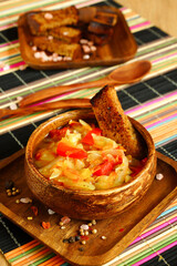 Thick cabbage soup in a wooden bowl. Traditional Russian soup with rye bread. Serving the dish - 431810500