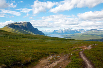 Hiking Kungsleden trail from Saltoluokta to Kvikkjokk in summer, Swedish Lapland.