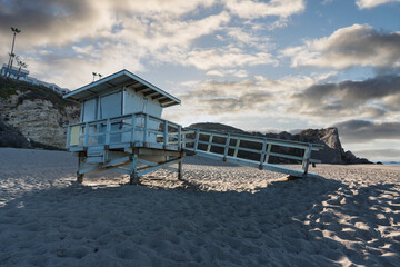 Sunrise view of lifeguard tower at Westward Beach in scenic Malibu, California.