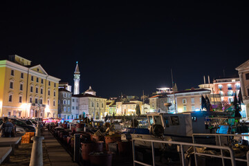 Fototapeta na wymiar Buildings of Piran at night, Piran nightlife