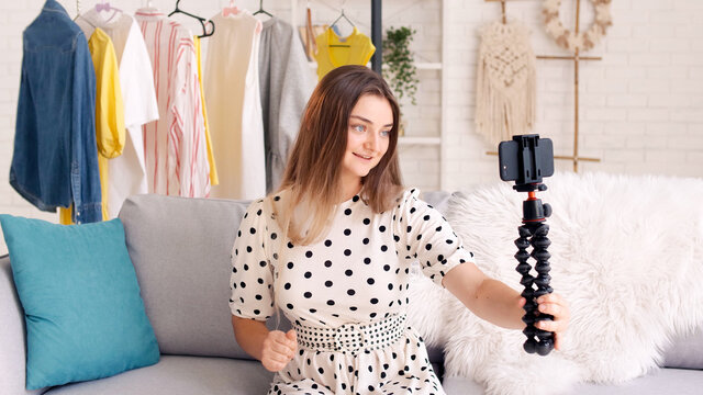 A Sweet Lady Blogger in a Dress Takes Pictures of Herself, Blogs, Creates New Content, Shares News With Her Subscribers. Remote Work During the Quarantine Period. Next Generation of Beauty Influencers