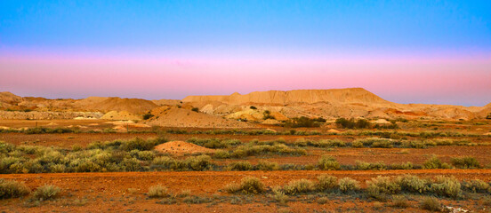 Night banner panorama of Coober Pedy opal mining town in Australia at twilight. Opal capital town...