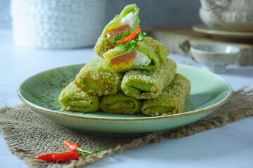 a plate of fried risoles mayonnaise on the table