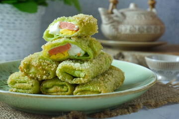 a plate of fried risoles mayonnaise on the table