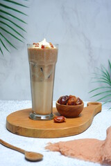 a glass of dates frappe in white background