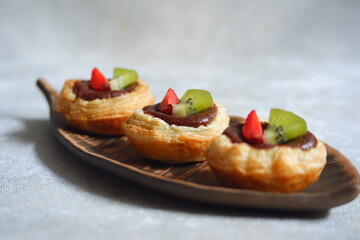 chocolate egg tart with fruits in a plate