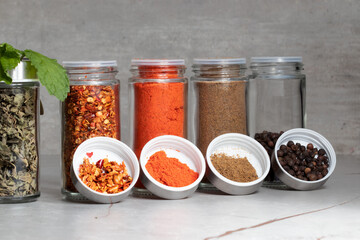 Various spices or seasonings on the table.