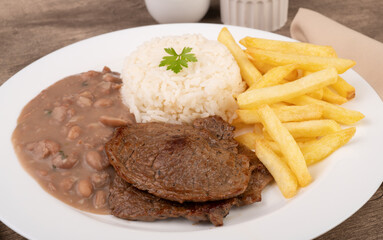 Beef, rice, beans and french fries. Typical brazilian executive dish