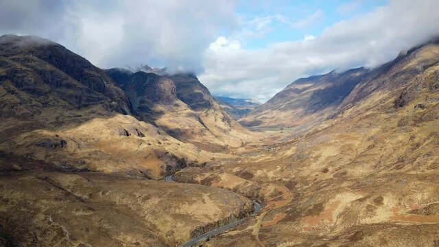 Scotland, Glencoe pass way from the air, road between mountains.