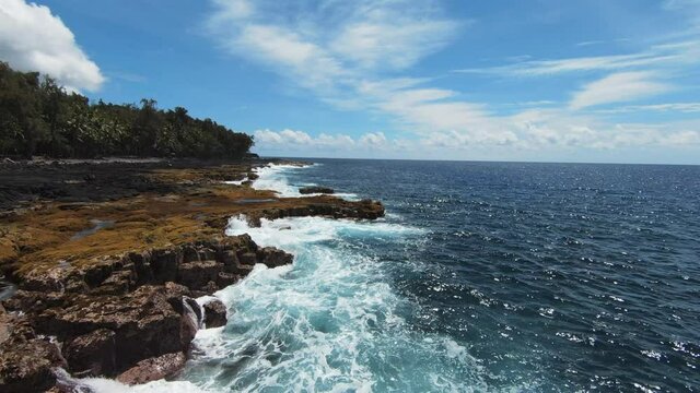 Beautiful scene of Hawaiian coast on sunny day. FPV drone dolly forward