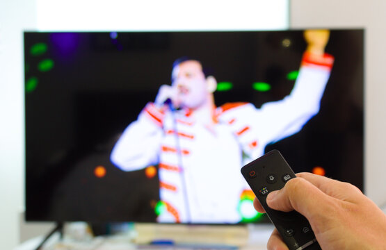 Caucasian Male Watching Television Resting In The Bed And Switching Channels Virtual Gig Concert Horns Up