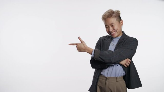 Young Asian person interacts with logo or graphic space on white