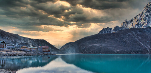 Stunning view of Gokyo Lake and Village from the ground under a dramatic sky, Himalayas, Nepal