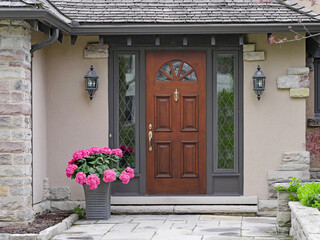 Fototapeta na wymiar House entrance with elegant wooden front door