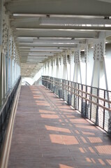 Obraz premium Rawamangun, Jakarta Indonesia, April 23, 2021: A pedestrian flyover structure that connects the busway stop with the LRT station.