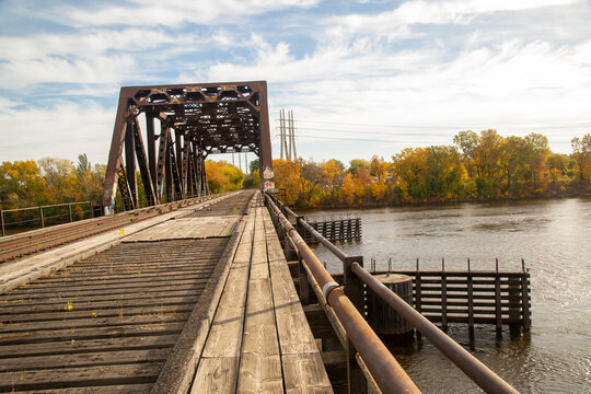 Old wooden railroad bridge going over the Mississippi River near downtown Minneapolis Minnesota