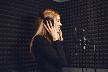 Singing and working in a studio with a microphone