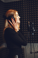 Singing and working in a studio with a microphone