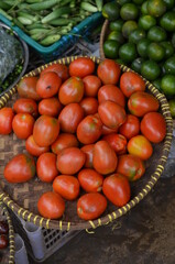 Heaps of red tomatoes on the market.