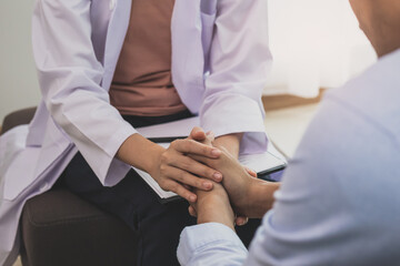 Young asian man, male suffers from a mental who needs to therapy with a psychologist while sitting...