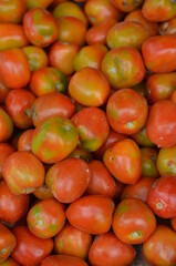 Heaps of red tomatoes on the market.