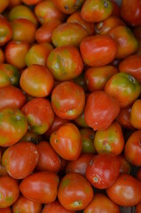 Heaps of red tomatoes on the market.