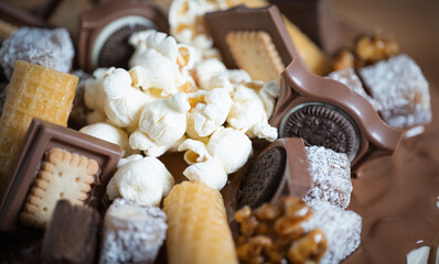 cake decorated with slices of chocolate and popcorn