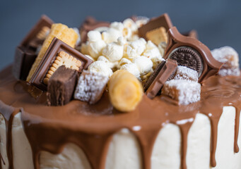 cake decorated with slices of chocolate and popcorn