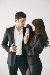 Portrait of young couple in love posing at studio