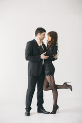 Portrait of young couple in love posing at studio