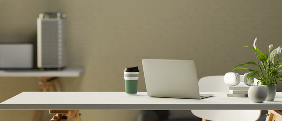 3D rendering, simple portable workspace with laptop, supplies, tumbler, plant pot and copy space