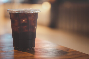 Soft drink with ice in takeaway cup