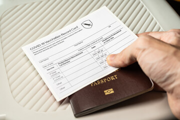 Fototapeta premium Covid-19 vaccination record card and passport