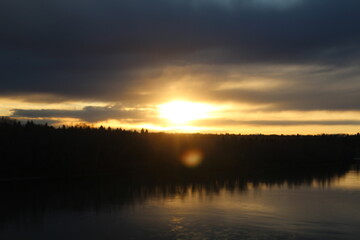 Fototapeta na wymiar Setting Sun Over The River, Gold Bar Park, Edmonton, Alberta